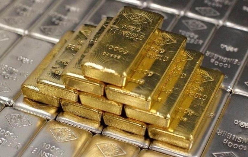 Stack of gold bars on silver bars
